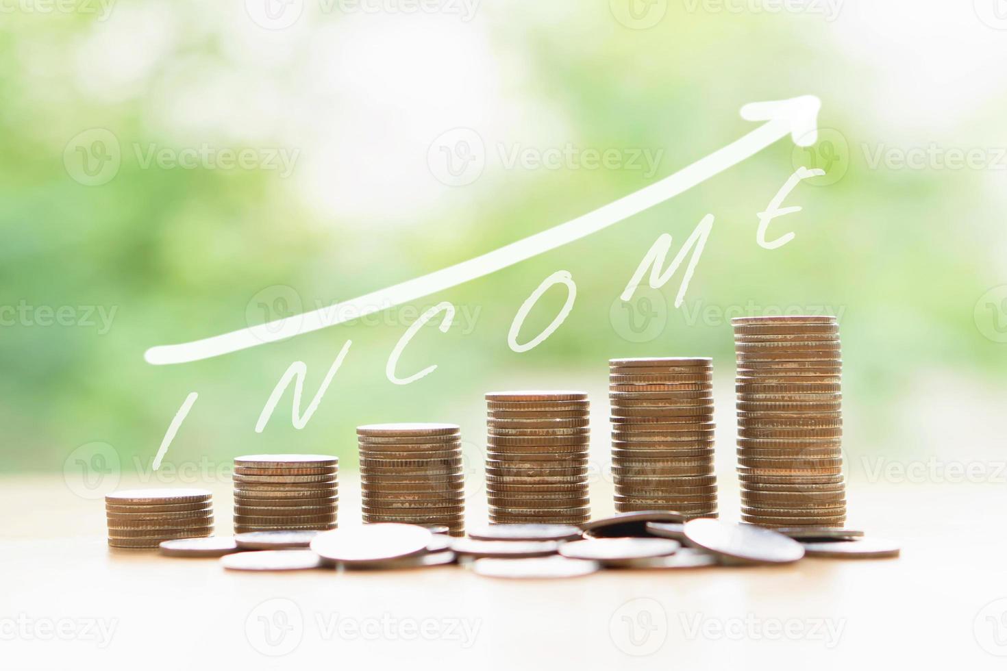 Money coins stack growing graph bank on nature background, growing income business concept. photo