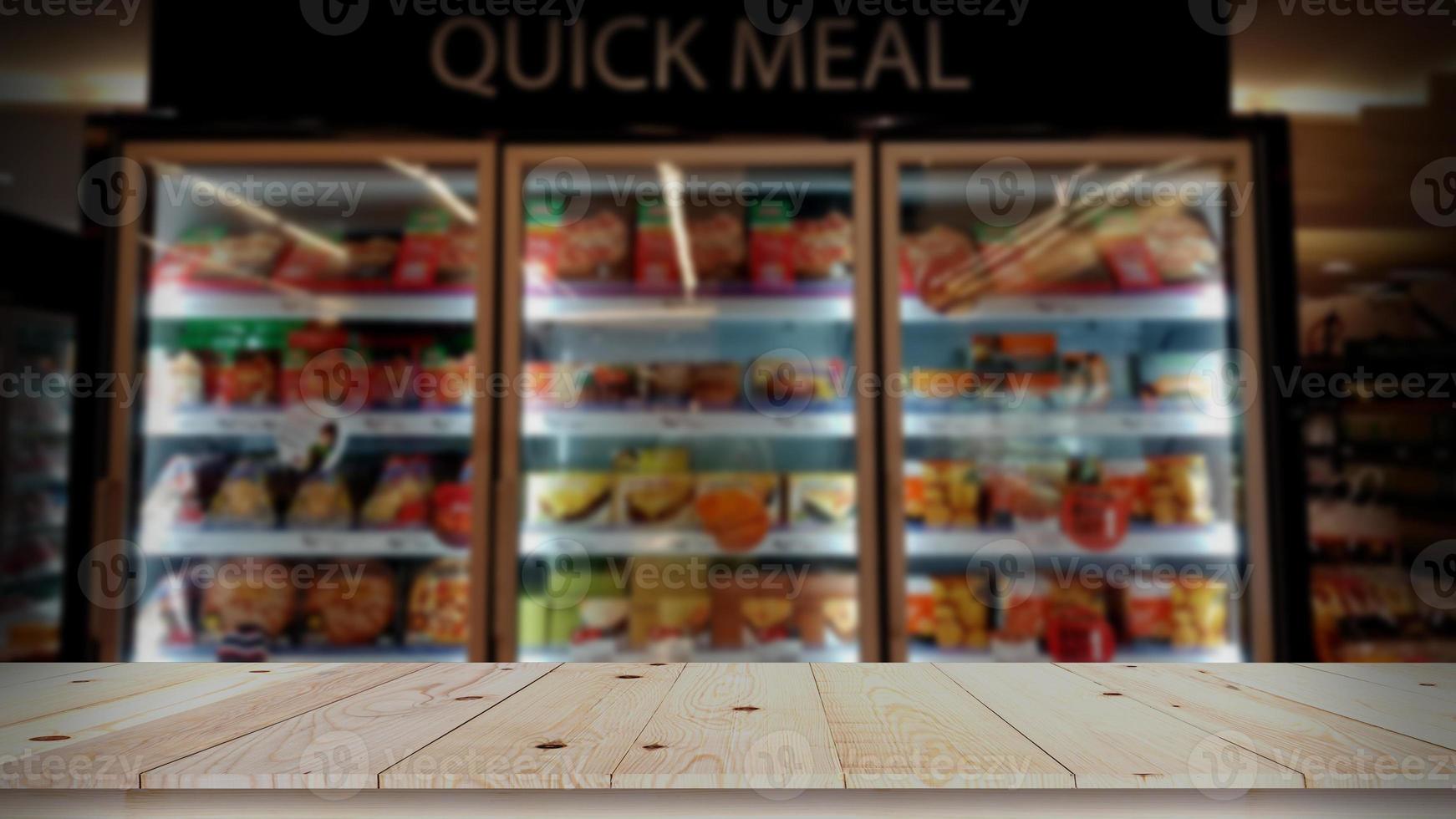 Empty wood table top with quick meal blurred background photo