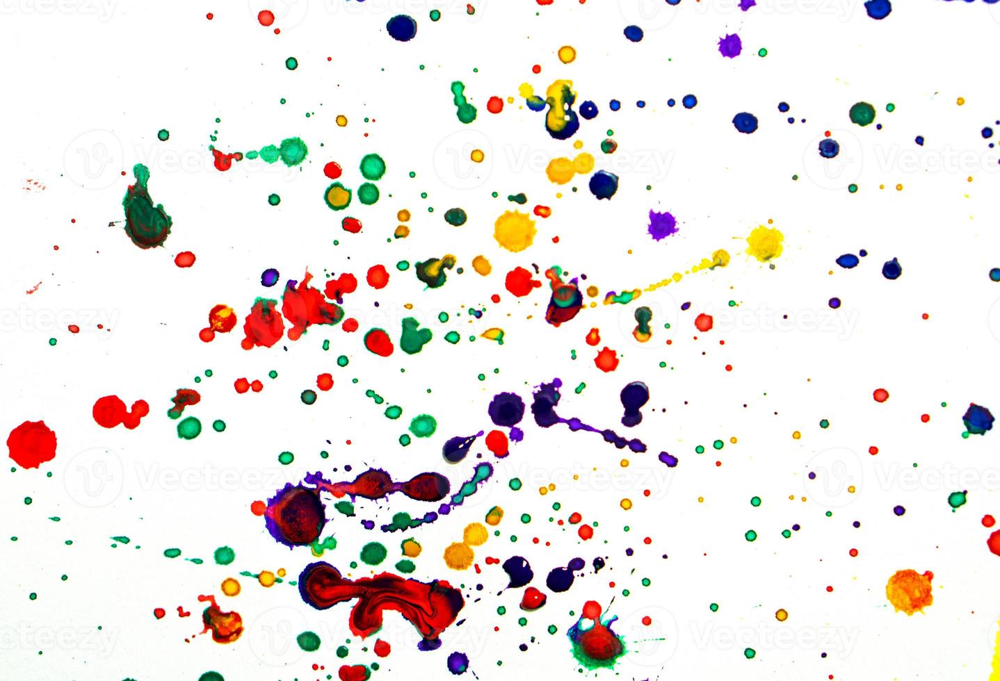 Colorful watercolor drops or splashes on white background photo