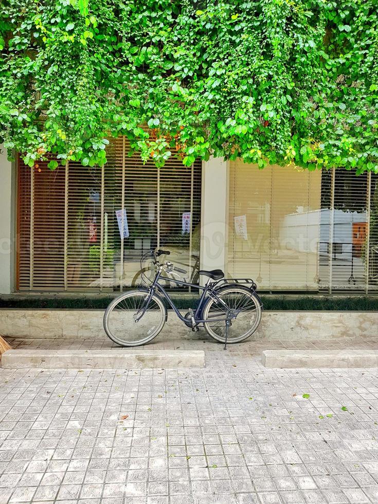 Bicycle in Front of a Entrance to the Coffee Shop photo