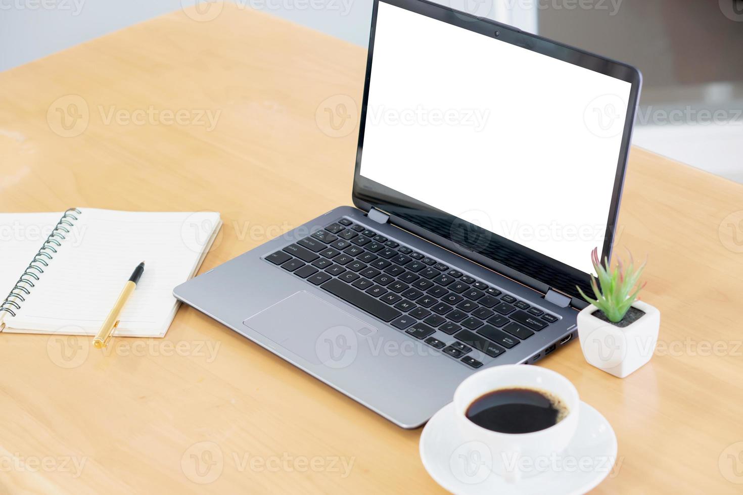 Laptop and gadgets on table photo