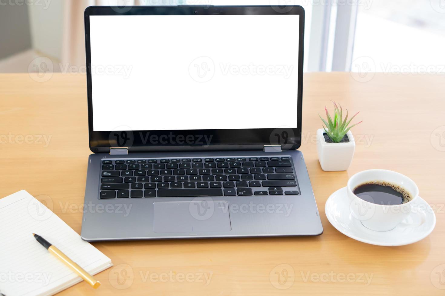 Laptop and gadgets on table photo