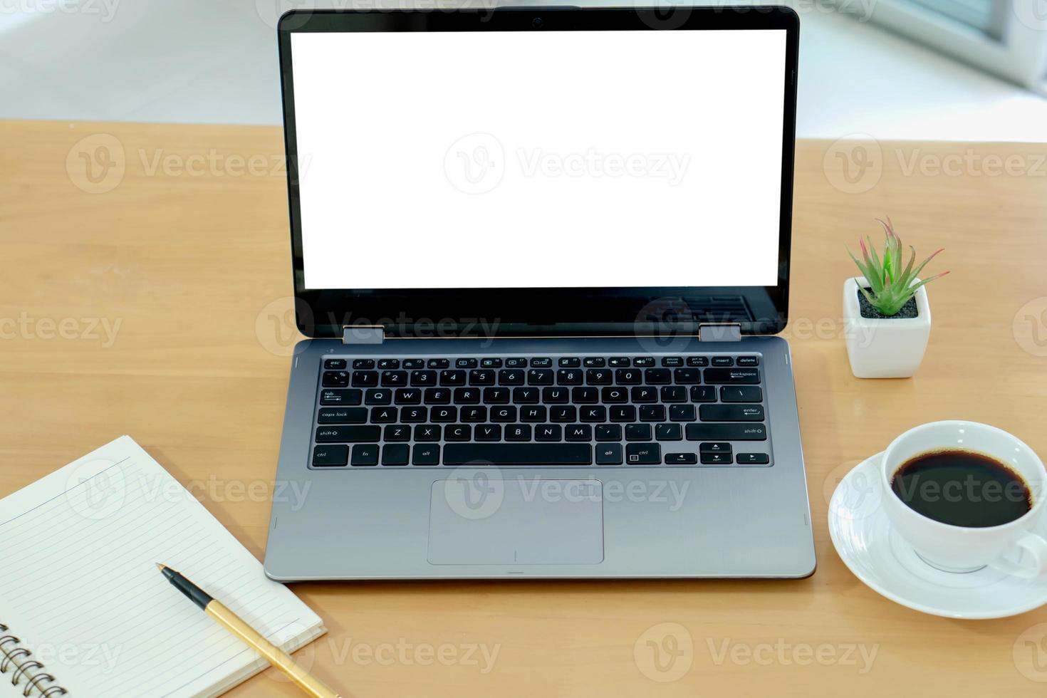 Laptop and gadgets on table photo