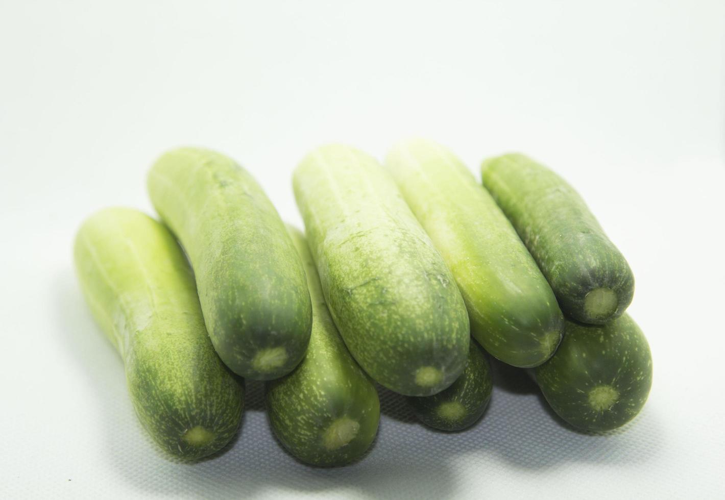 Green cucumbers are sweet and crispy, planted organically for health and body on a separate white background. photo