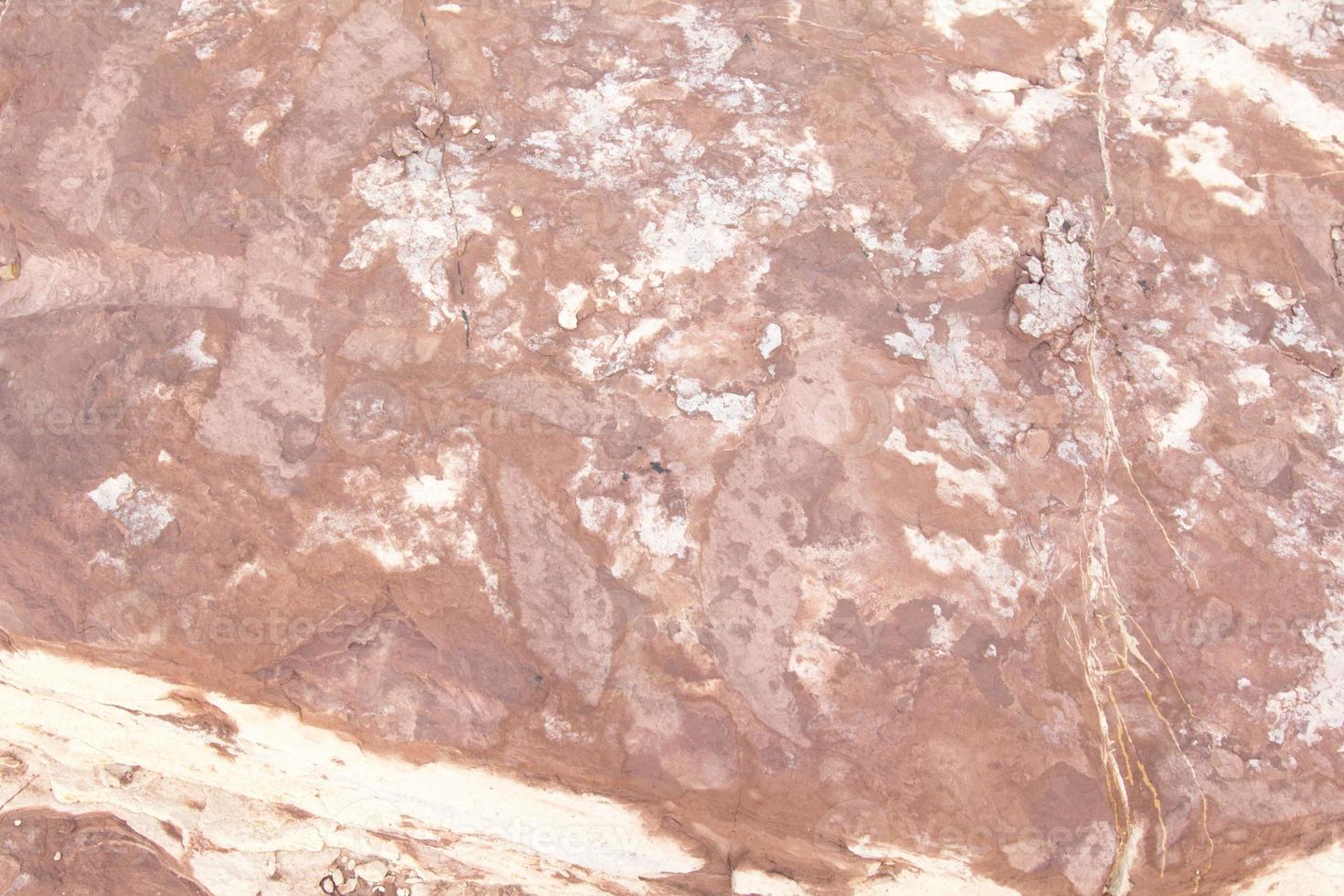Red sandstone is a large stone used for landscaping, decorating the garden to look natural with man-made and many patterns on the surface. photo