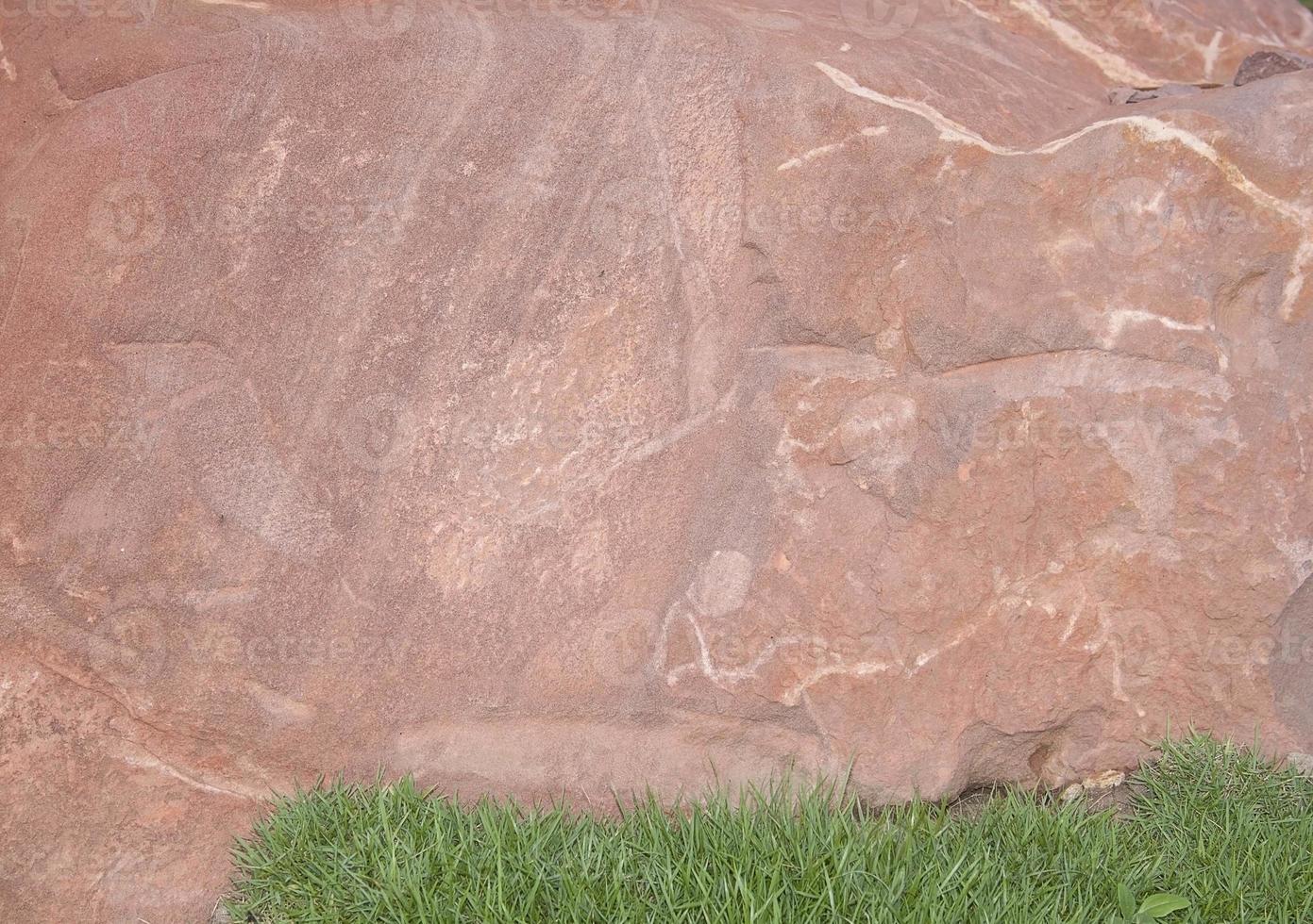 Brown stone with large patterns that are designed to be like nature by heavy machinery, beautifully crafted in a vast lakeside garden, perfect for relaxing and watching nature in summer and winter. photo