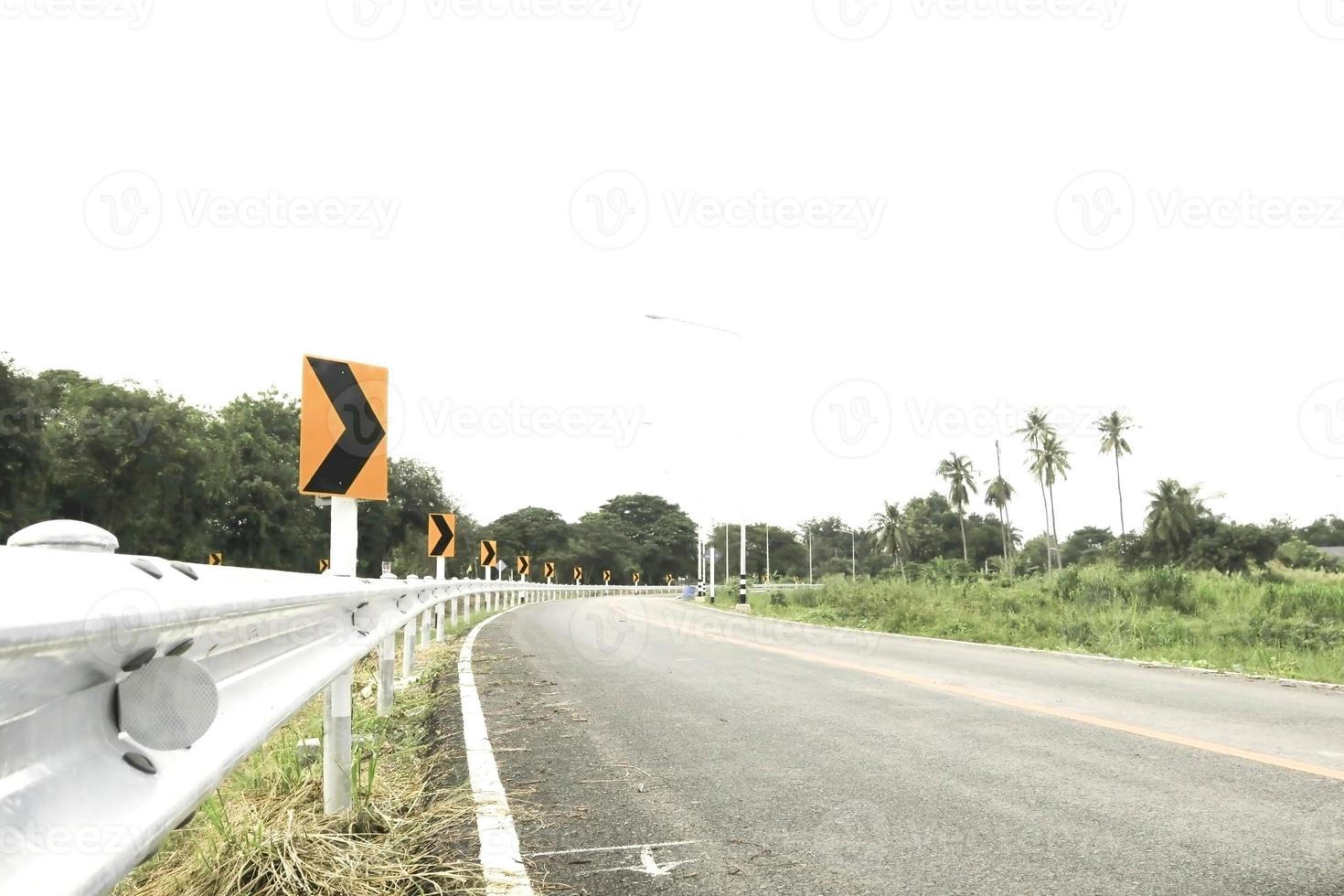 Turn left with a sign for driving, be careful of curves and slow speeds for your own safety, as there may be an accident at any time. photo