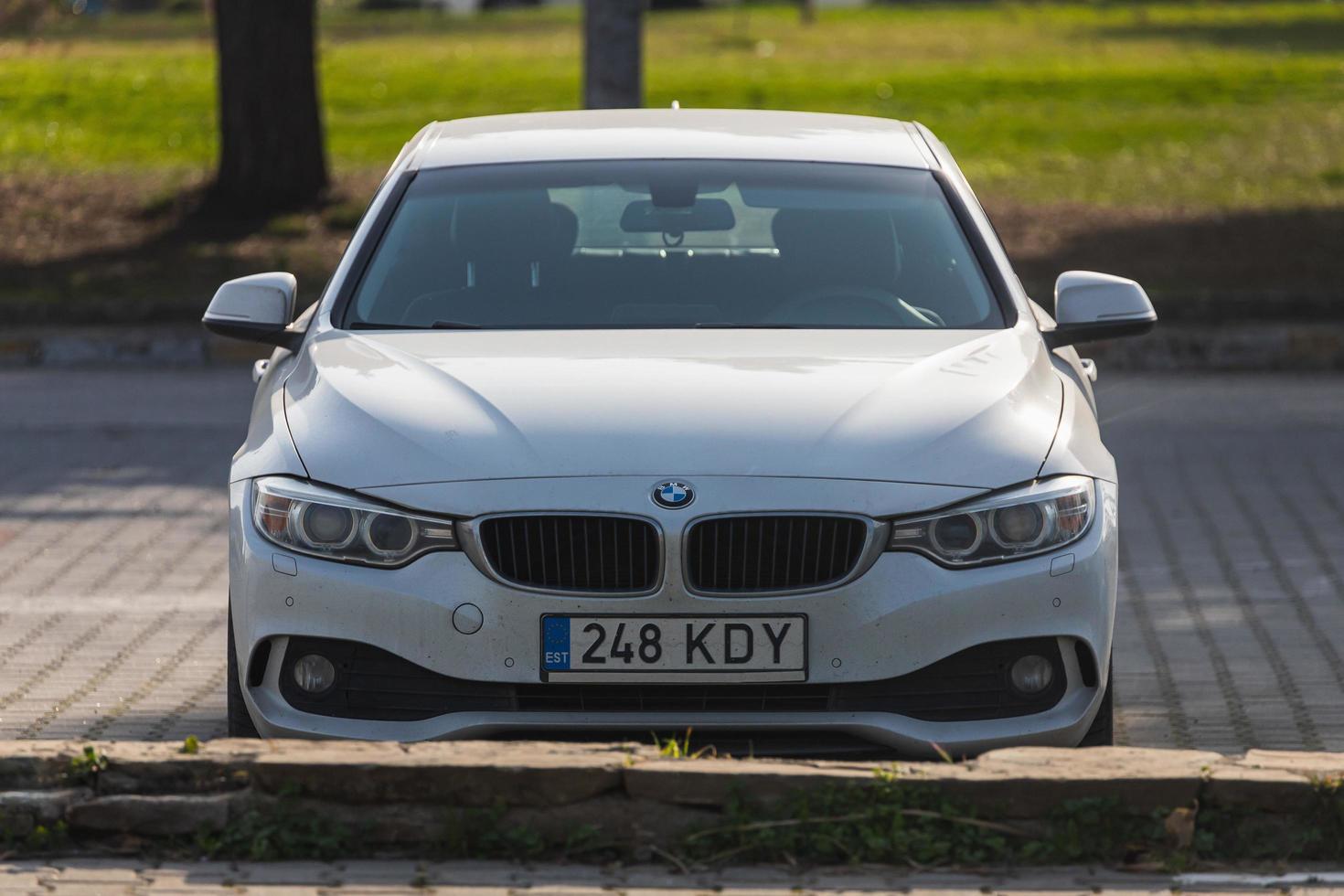Side  Turkey  February 18 2022 white BMW 3 series is parked  on the street on a warm  day photo