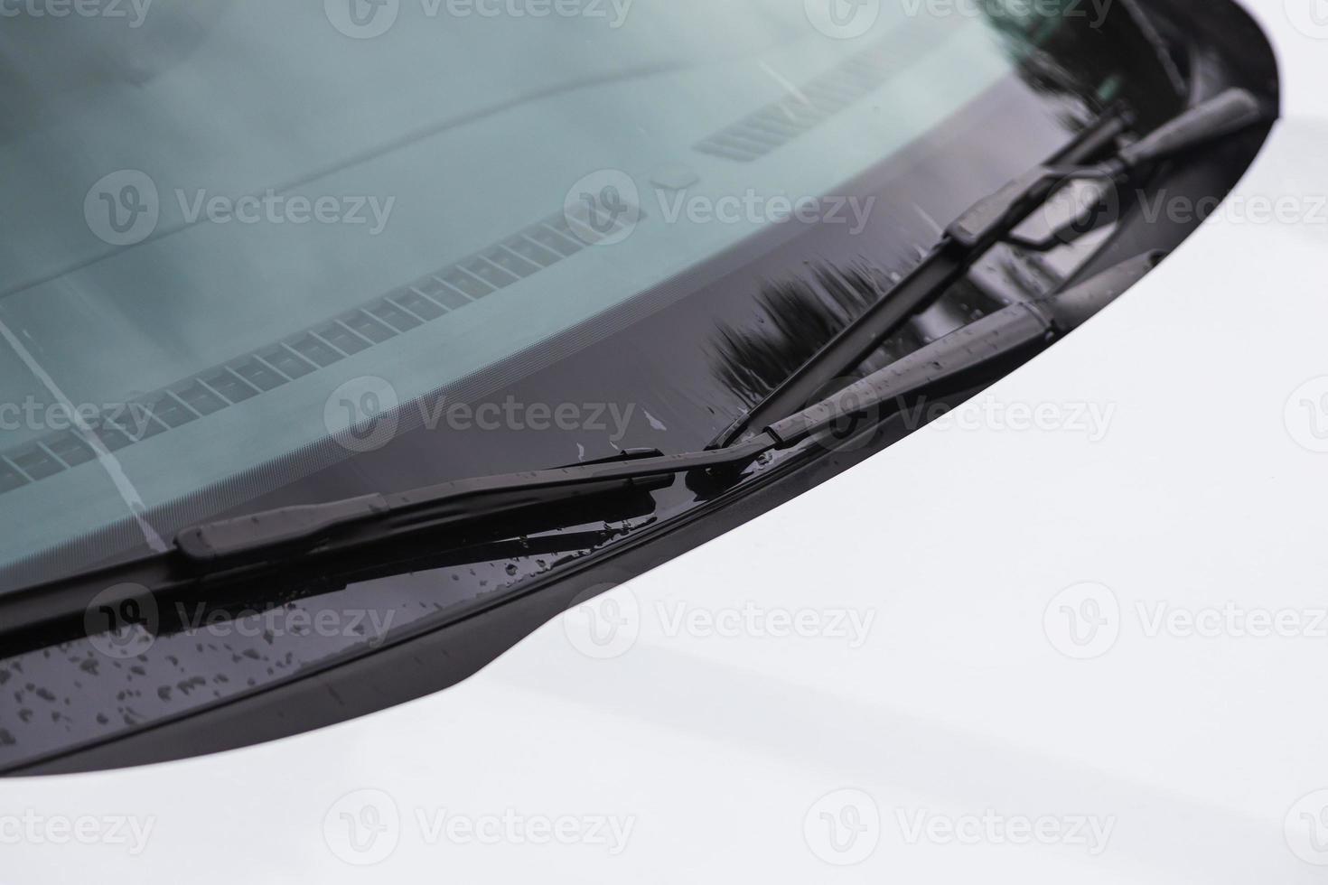 car's windshield rain wiper close uo photo