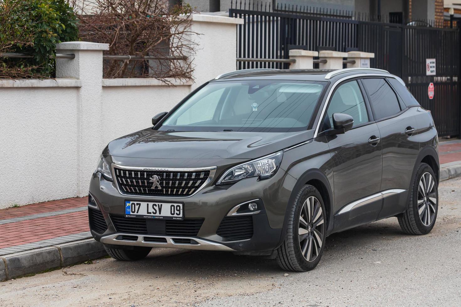 Side Turkey  February 23 , 2022  gray  Peugeot 3008   is parked  on the street on a warm day photo