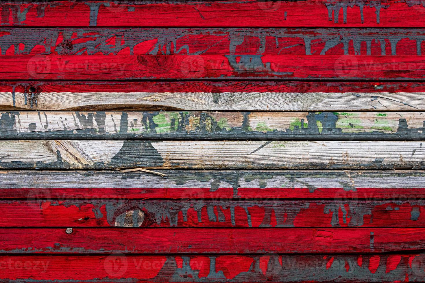 The national flag of Austria  is painted on uneven boards. Country symbol. photo