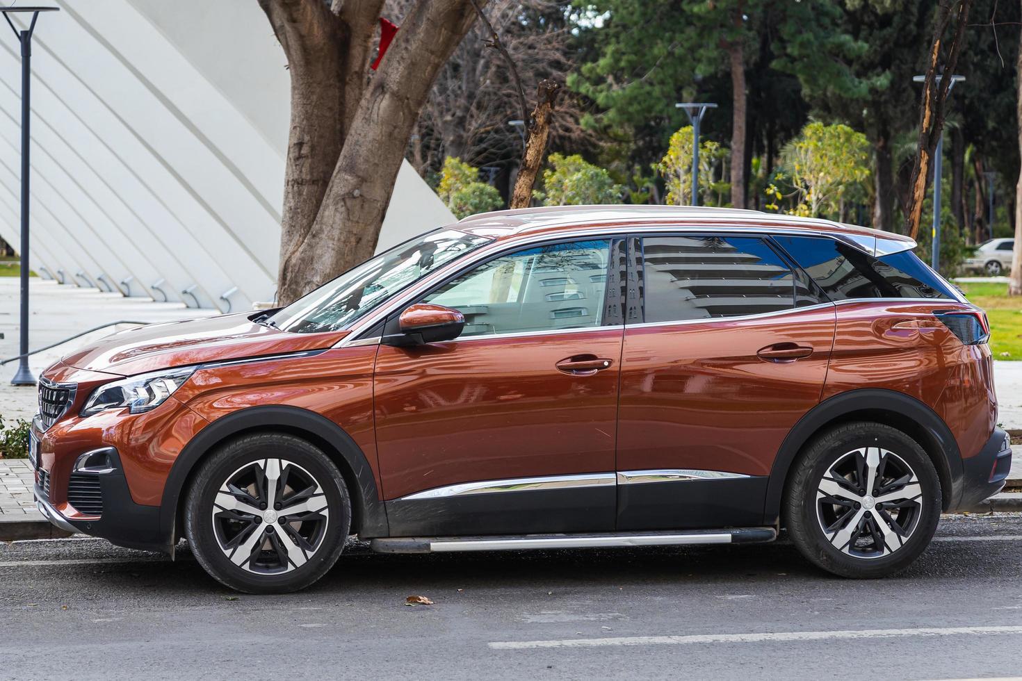 Side Turkey  February 20 2022  orange  Peugeot 3008  is parked  on the street on a warm day photo