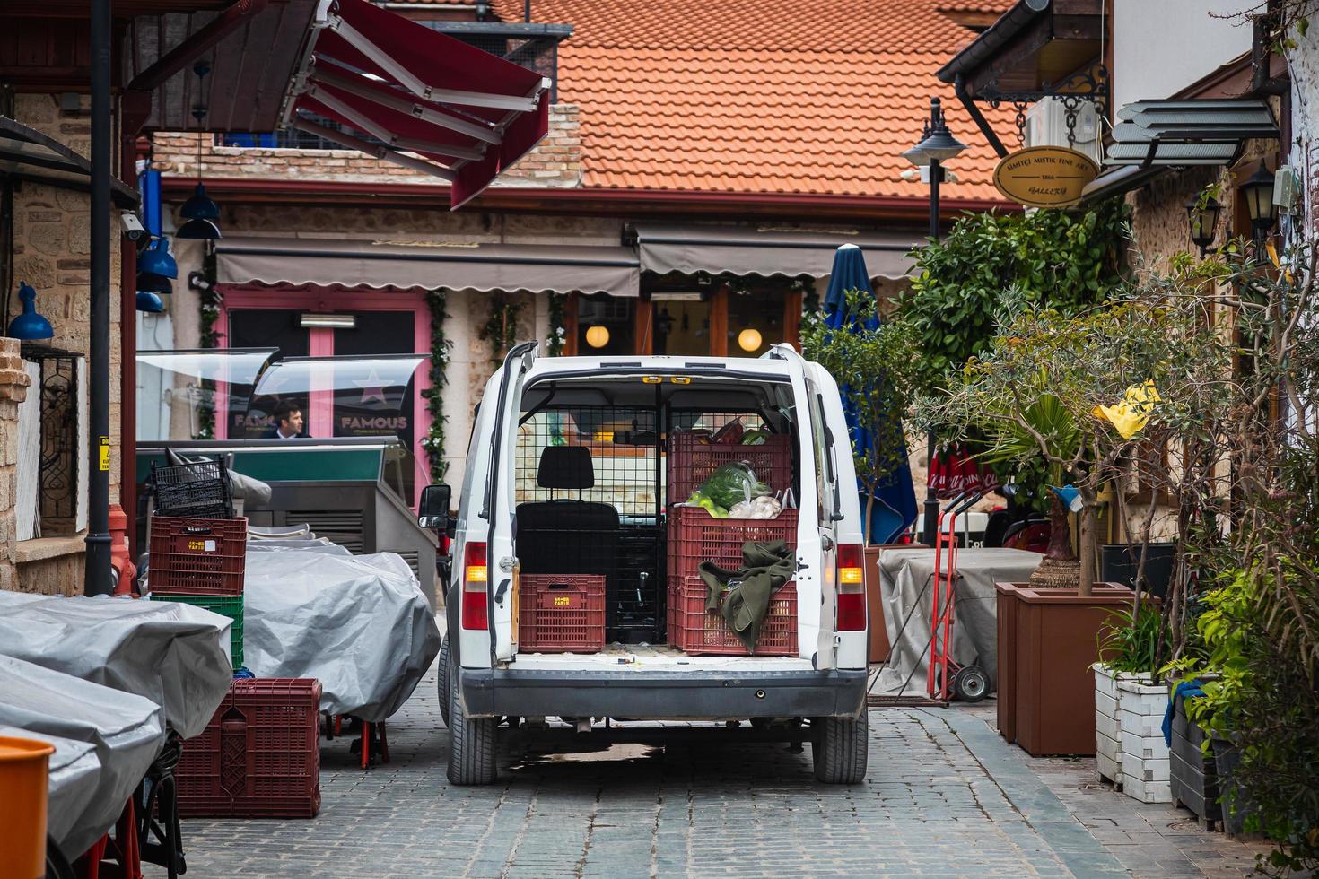 Antalya  Turkey February 20 2022 close up of a cargo minivan stands on a city street with open rear doors for unloading photo