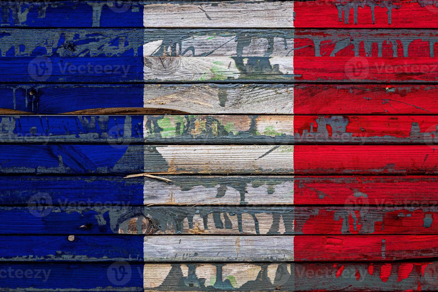 The national flag of France is painted on uneven boards. Country symbol. photo