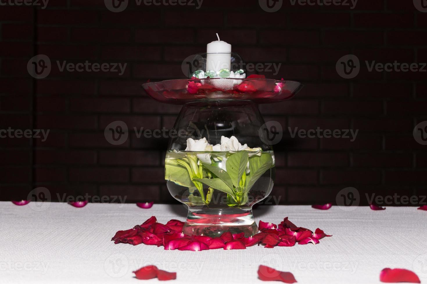 Centerpiece of glass and flowers photo