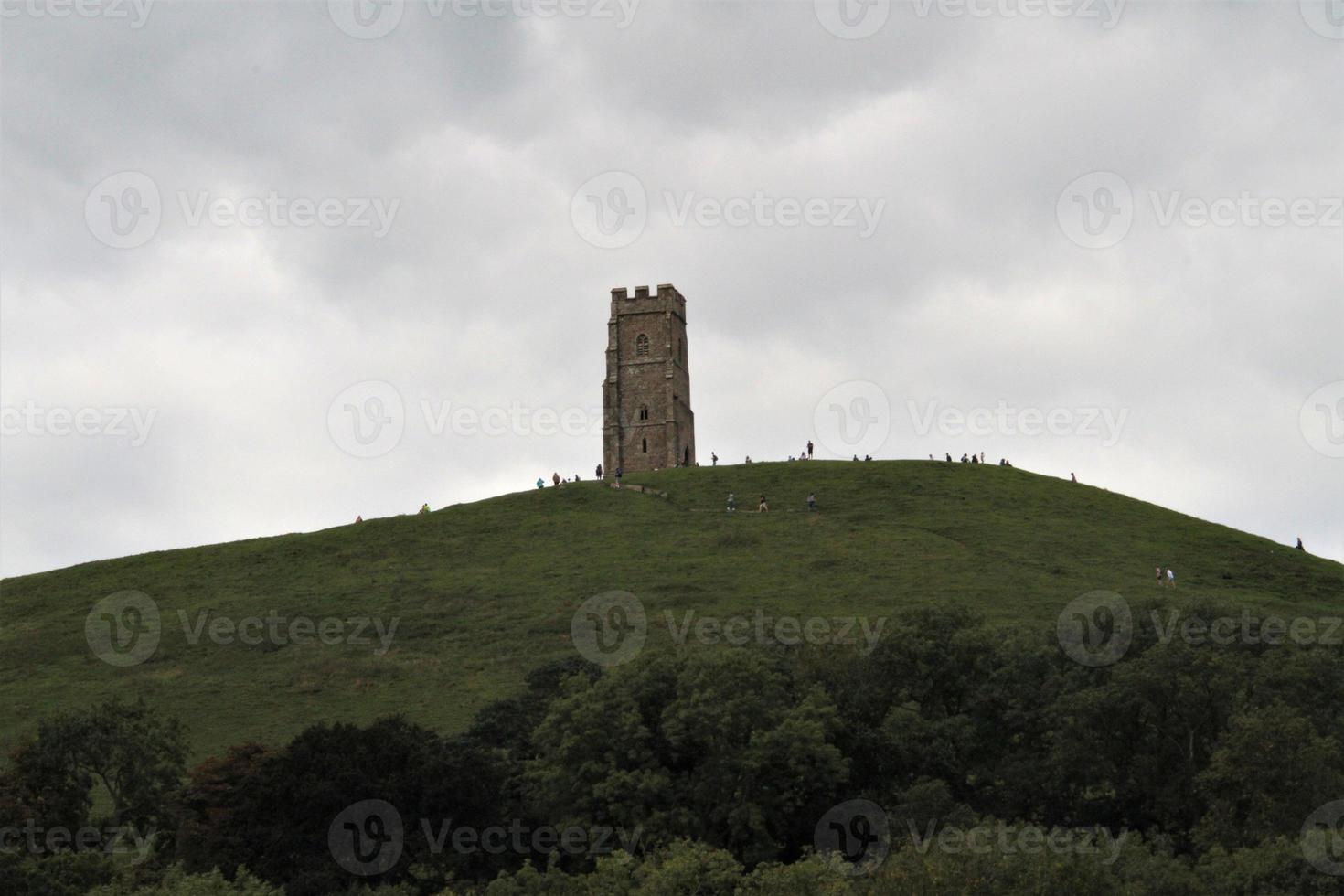 A view of the Glastonbury Tor set on a hill photo