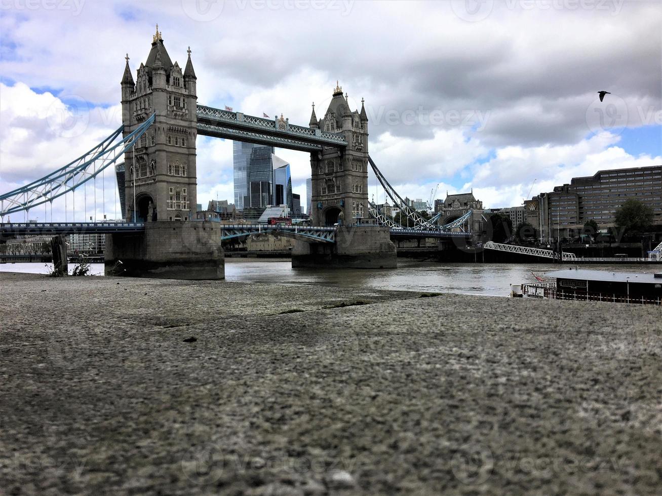 A view of Tower Bridge in London with drawbridge opening photo