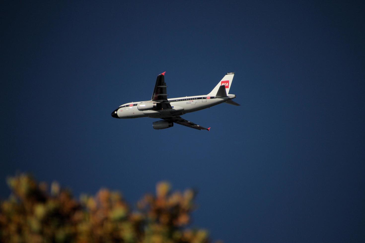 London in the UK in November 2020. A view of a plane passing over Richmond Park photo
