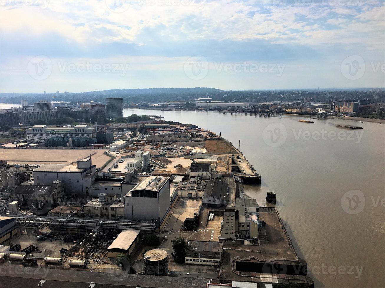 An aerial view of London over the River Thames near the Isle of Dogs photo