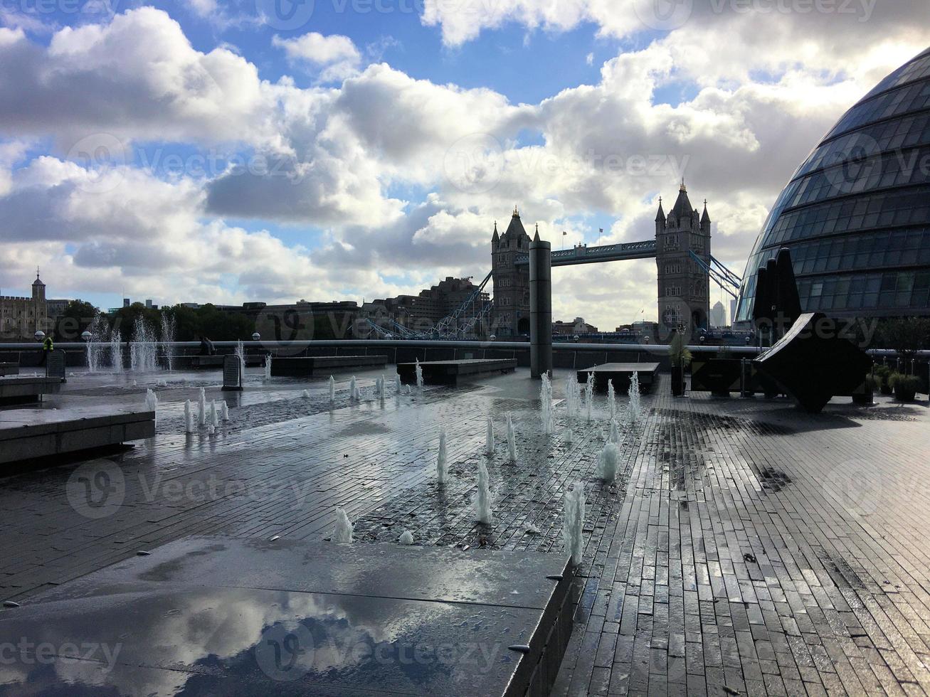 A view of Tower Bridge in London with drawbridge opening photo