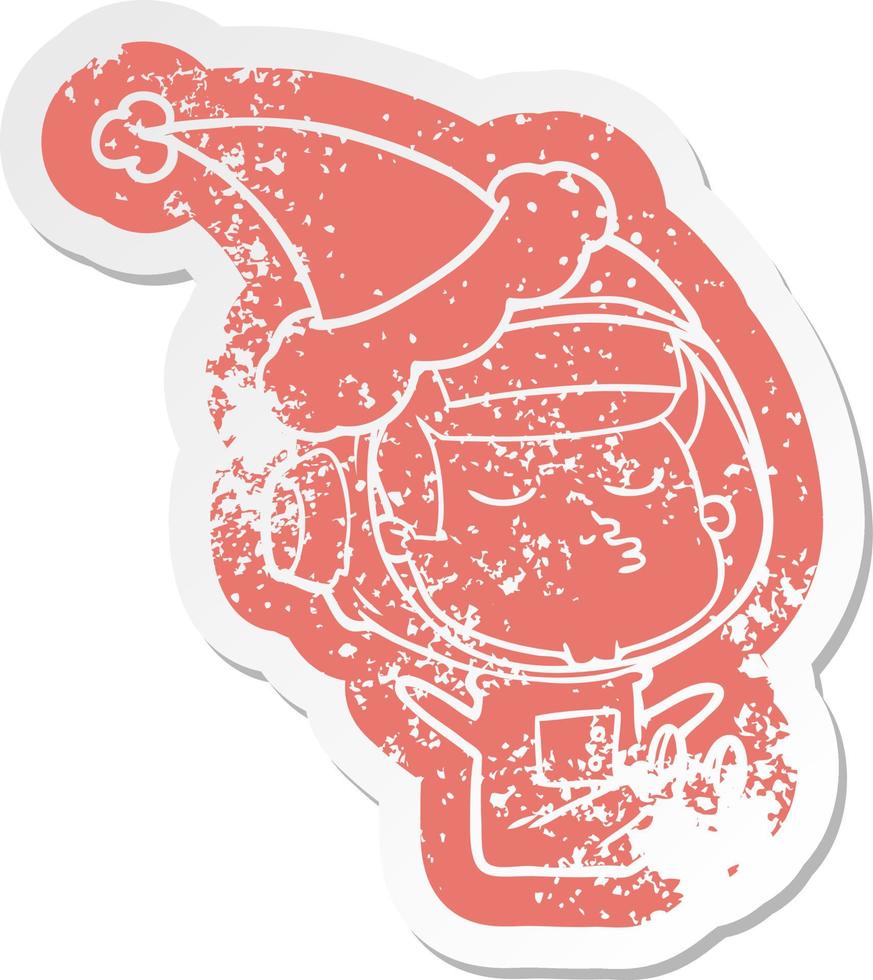 cartoon distressed sticker of a confident astronaut wearing santa hat vector