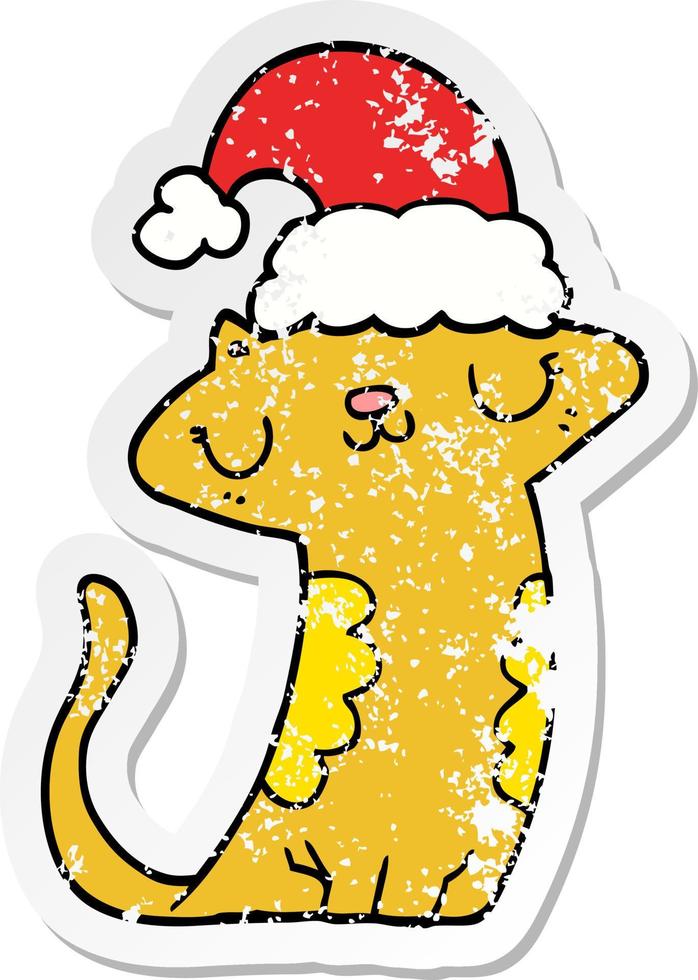 distressed sticker of a cute cartoon cat wearing christmas hat vector