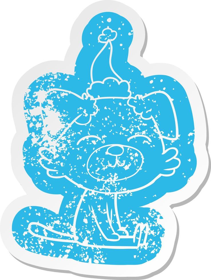 cartoon distressed sticker of a dog wearing santa hat vector