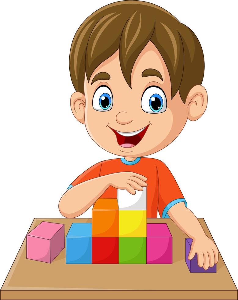 niño pequeño de dibujos animados jugando cubos en la mesa vector