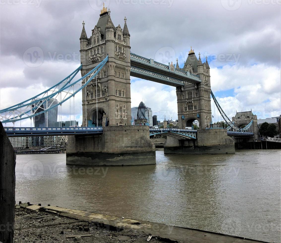 A view of Tower Bridge in London with drawbridge opening photo