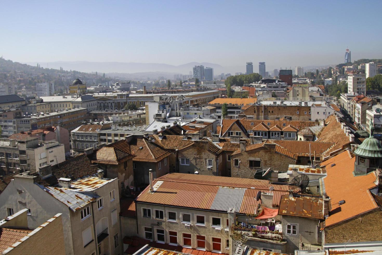 Sarajevo, Bosnia and Herzegovina - June 5, 2022 - Beautiful view over the city of Sarajevo with hills in the background on a sunny day. photo
