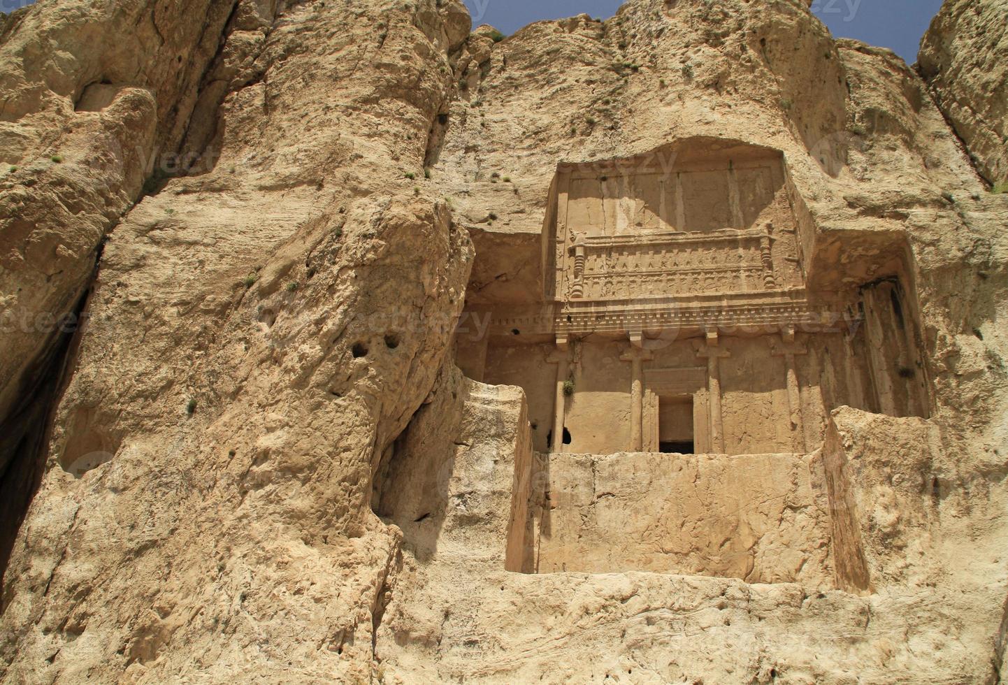 The massive tombs of Persian kings Darius and Xerxes near Persepolis in Iran photo