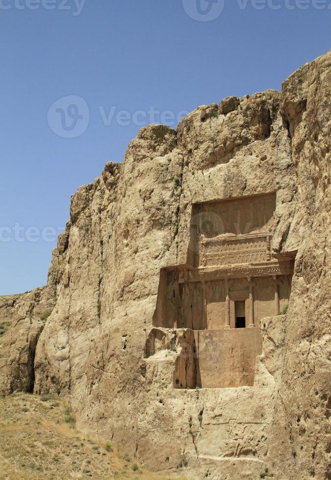 The massive tombs of Persian kings Darius and Xerxes near Persepolis in Iran photo