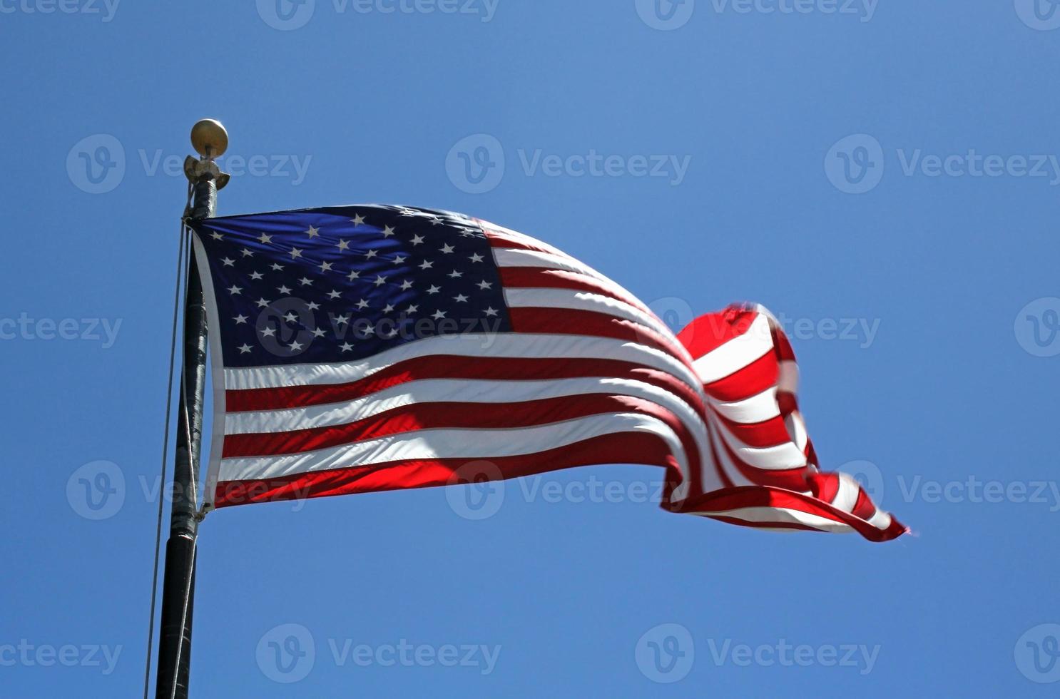 American flag waving in the wind photo