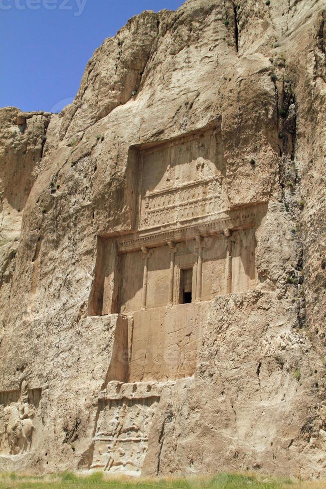 The massive tombs of Persian kings Darius and Xerxes near Persepolis in Iran photo