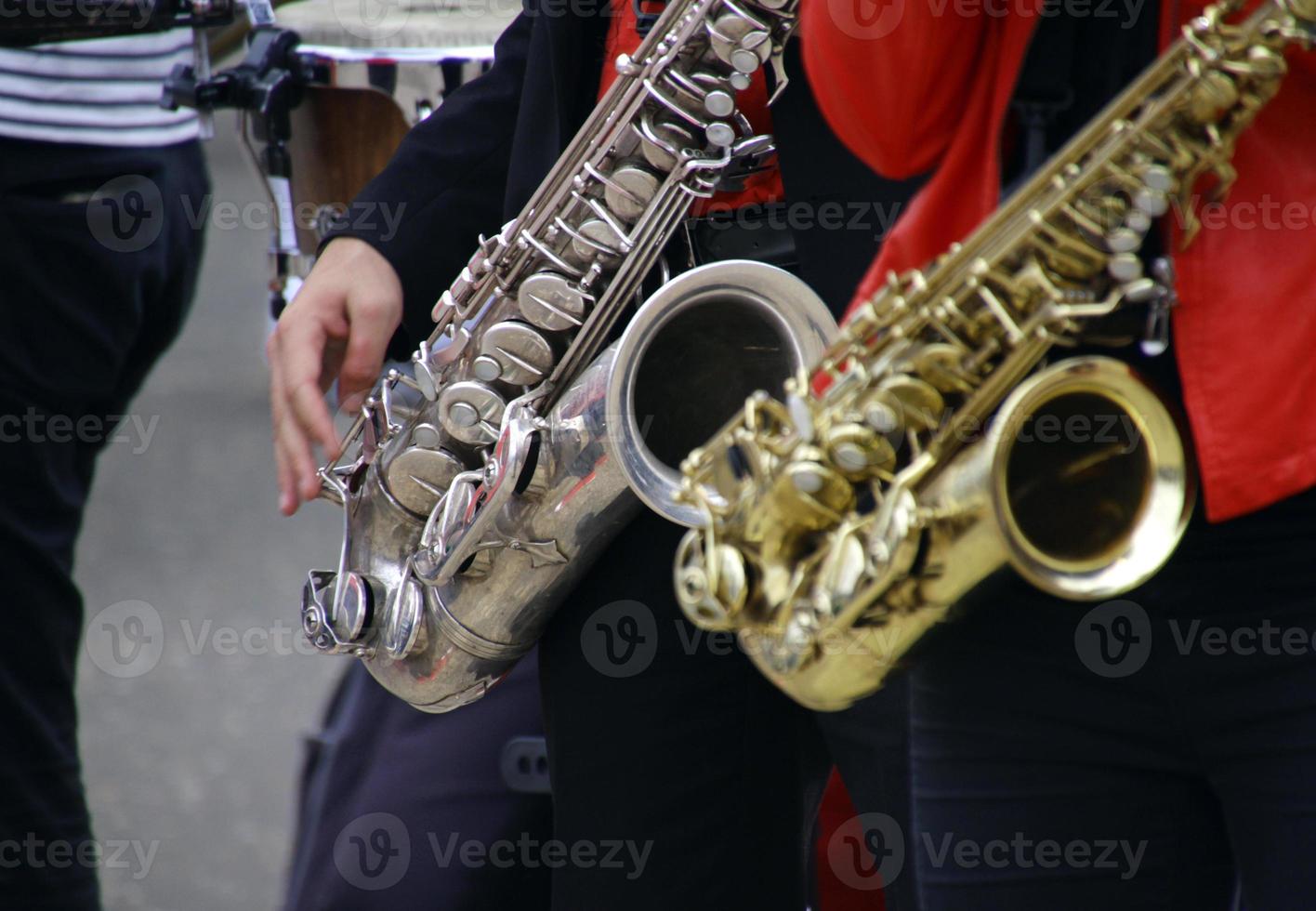 Two saxophone players during a performance photo