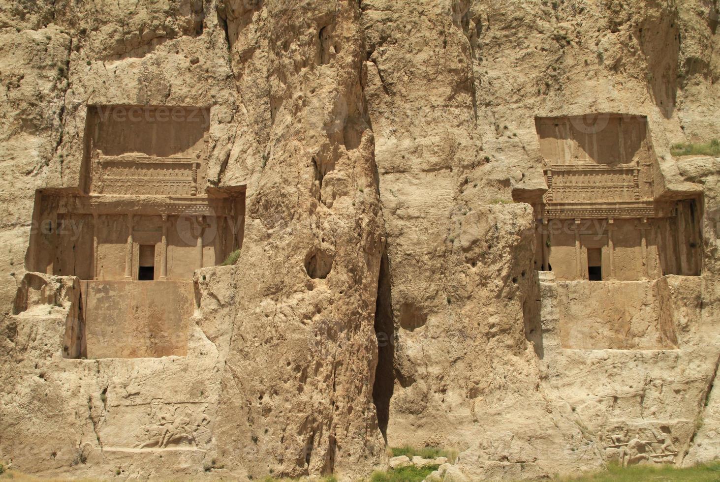 The massive tombs of Persian kings Darius and Xerxes near Persepolis in Iran photo