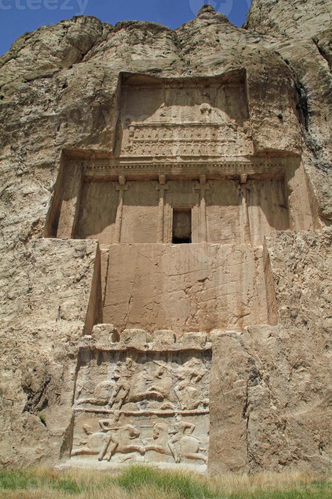 The massive tombs of Persian kings Darius and Xerxes near Persepolis in Iran photo