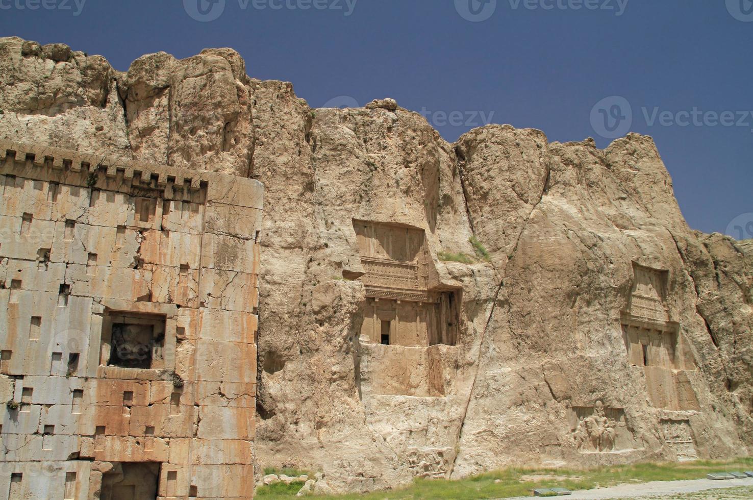 The massive tombs of Persian kings Darius and Xerxes near Persepolis in Iran photo