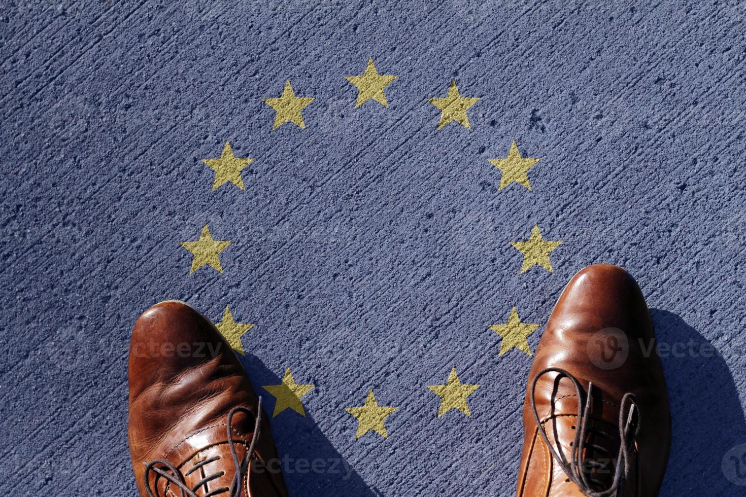 Man looking down on the European Union flag photo