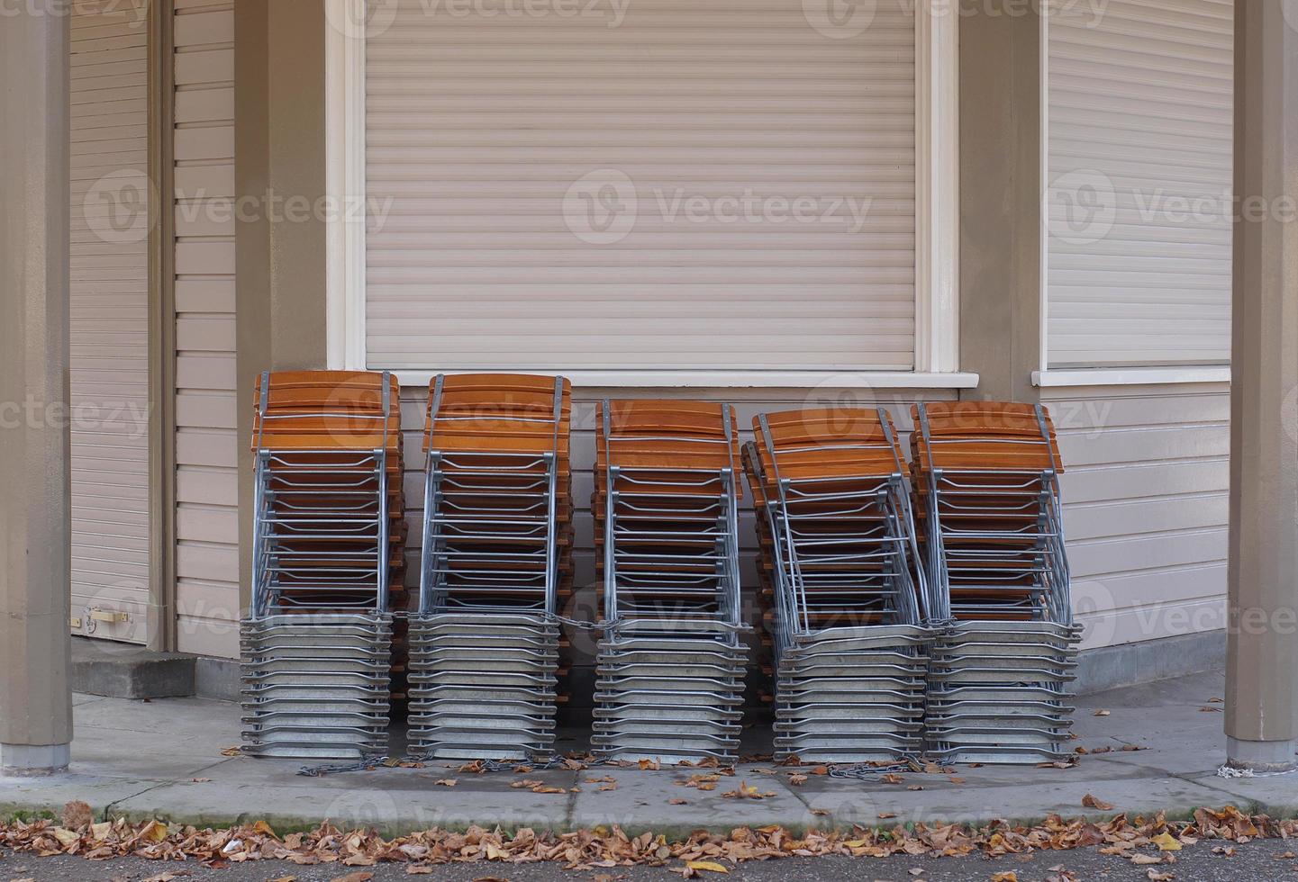 closed kiosk with stacked chairs photo