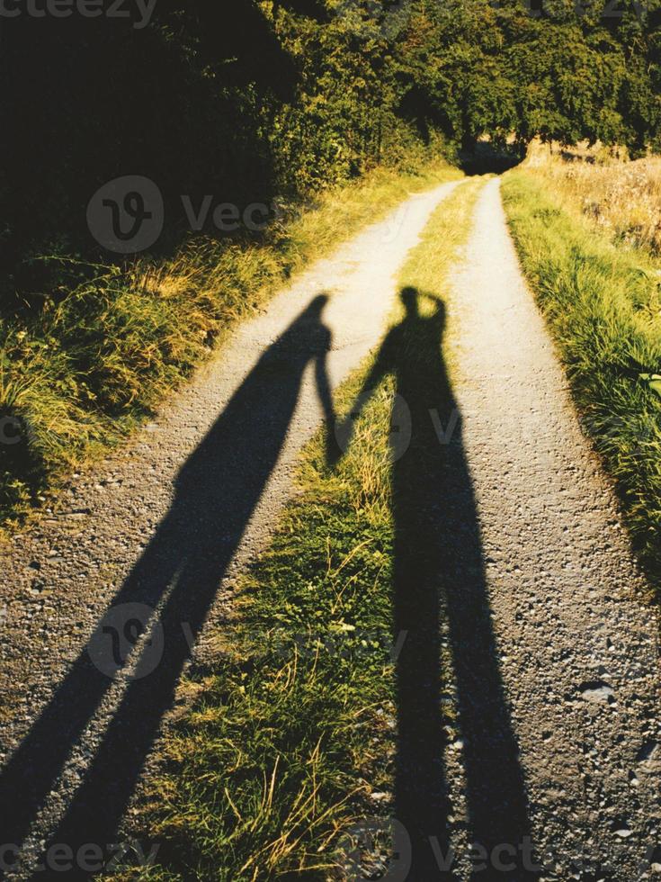 shadow couple holding hands photo