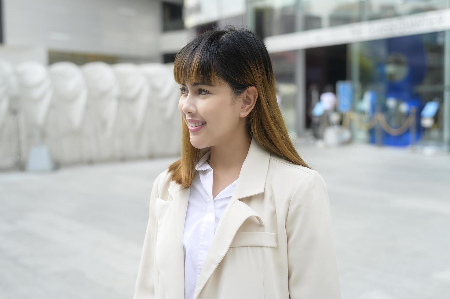 Portrait of young beautiful Business Woman smiling in modern office photo