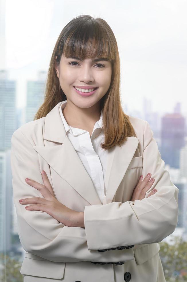 Portrait of young beautiful Business Woman smiling in modern office photo