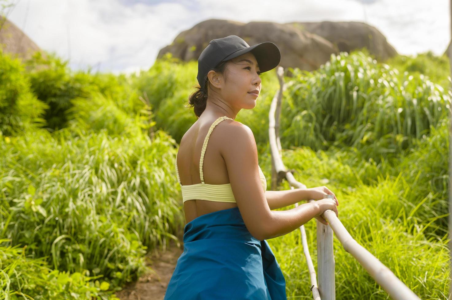 Beautiful asian woman in sportswear trekking on mountain trail, Travel and ecotourism concept. photo