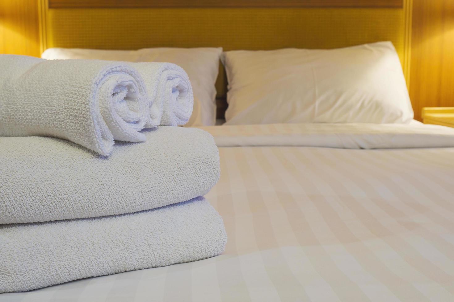 White bedding and towel set in modern hotel photo