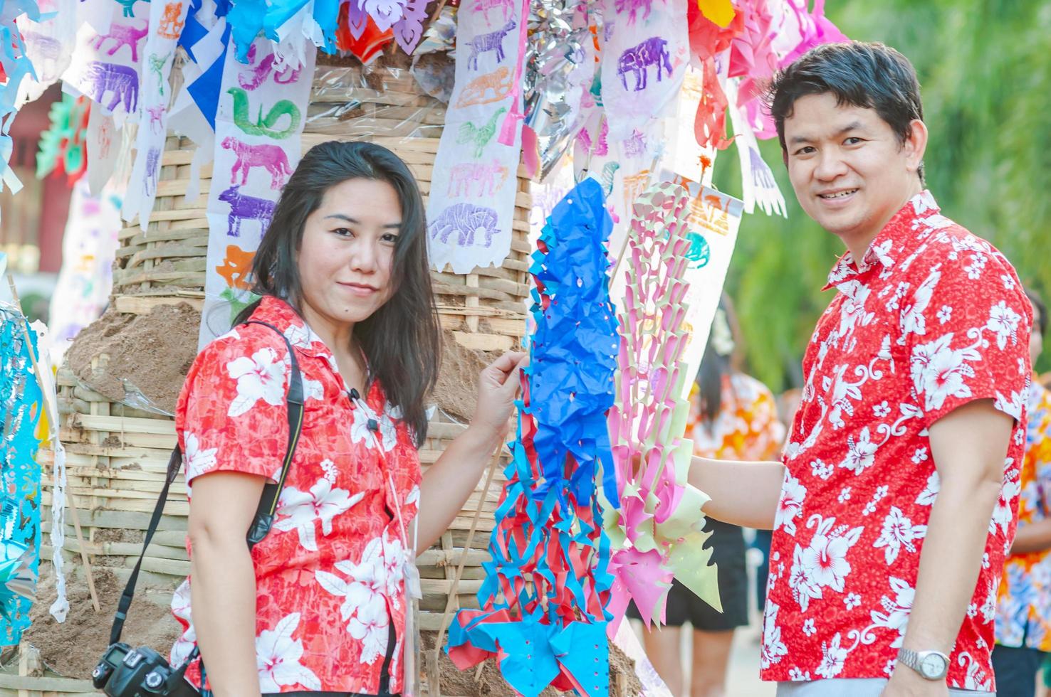 thai-family-participate-old-traditional-activity-in-a-temple-during