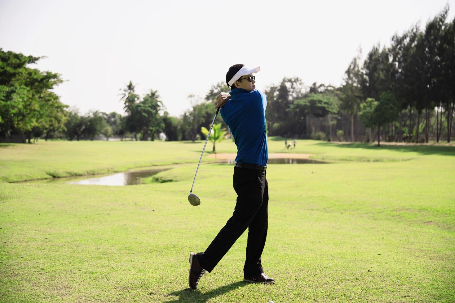 Man play outdoor golf sport activity - people in golf sport concept photo