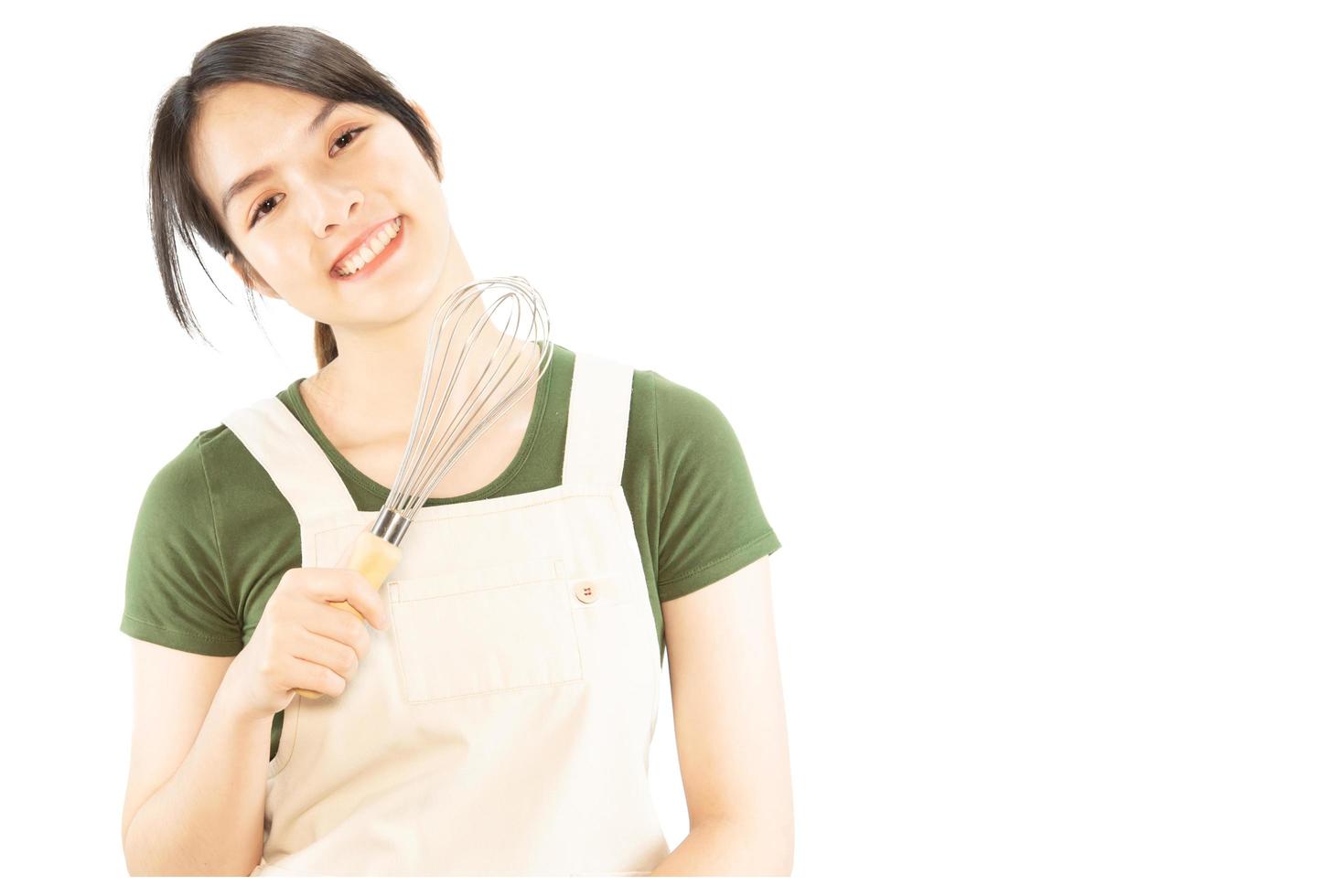 Happy lady holding kichen stuff over copy space background - people home made food preparation concept photo