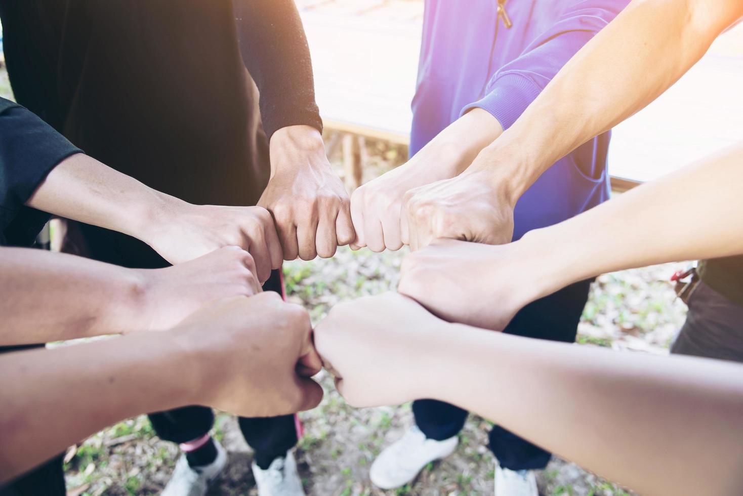 Man touching - holding hand together for success commitment work concept photo