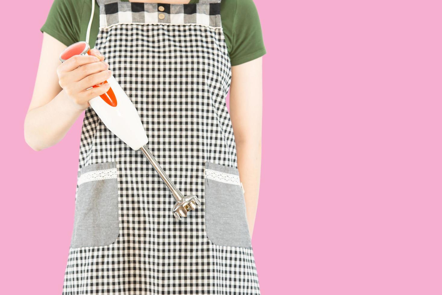 Happy lady holding kichen stuff over copy space background - people home made food preparation concept photo